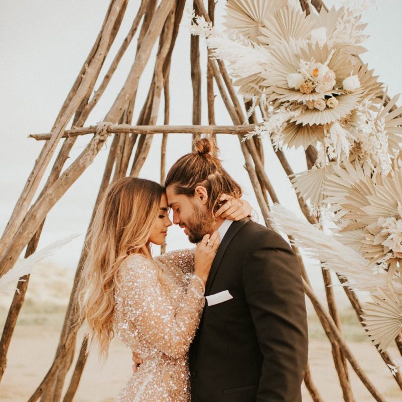 Intimate wedding portrait with bride in sparkly wedding dress