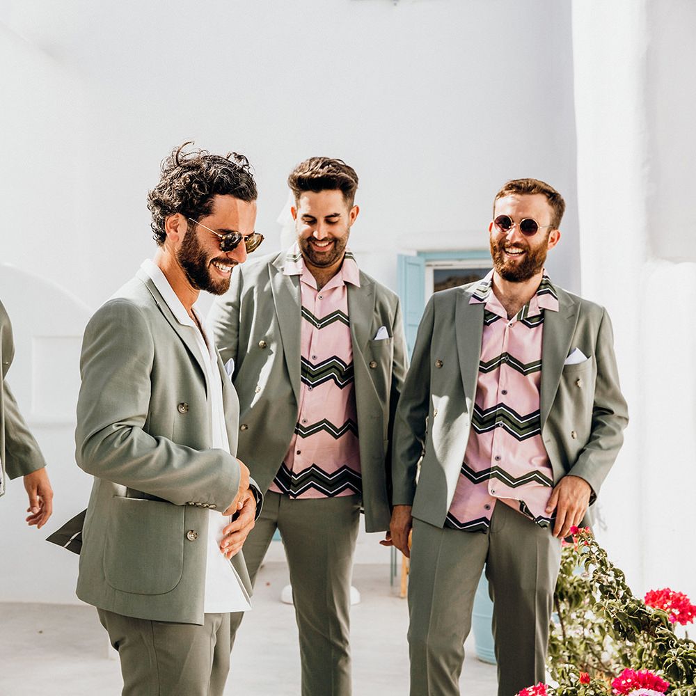 Sage green wedding suits with patterned shirts for groomsmen