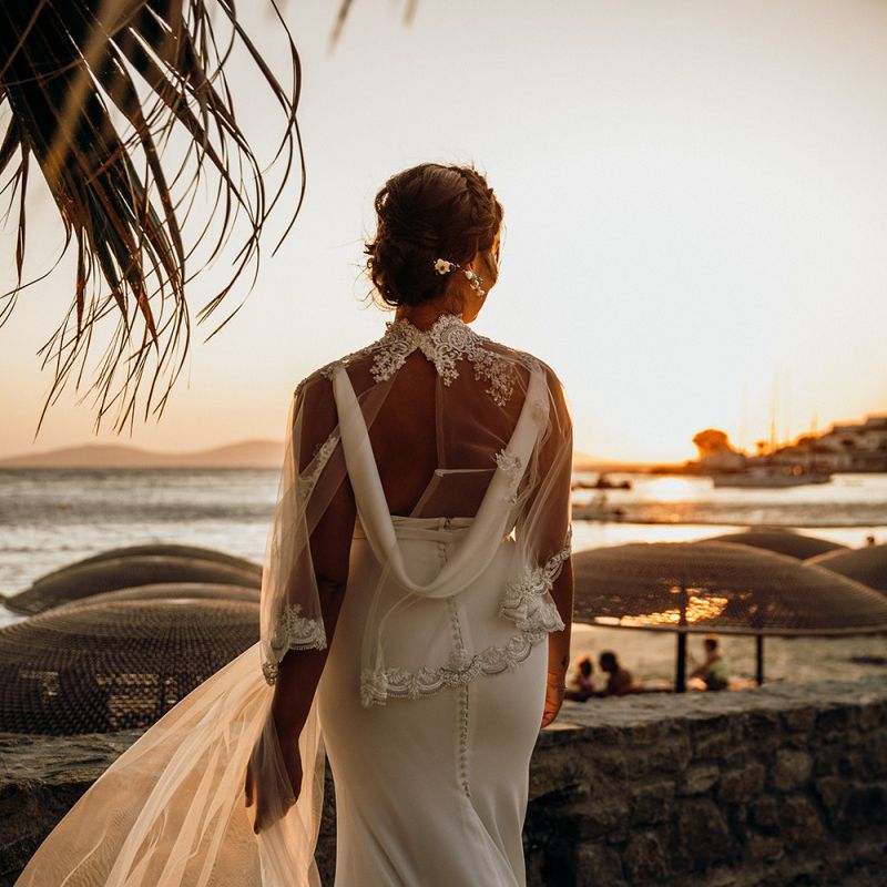 Cowl back wedding dress with wedding capelet over