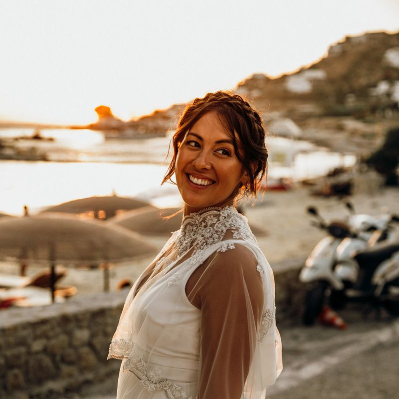 Pregnant bride wearing wedding capelet