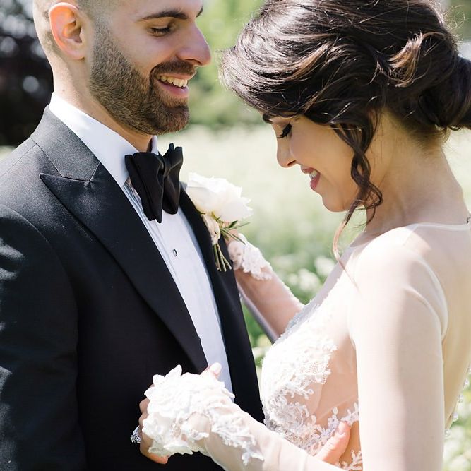 Intimate Bride and Groom Portrait in Black Tie Wedding Outfits