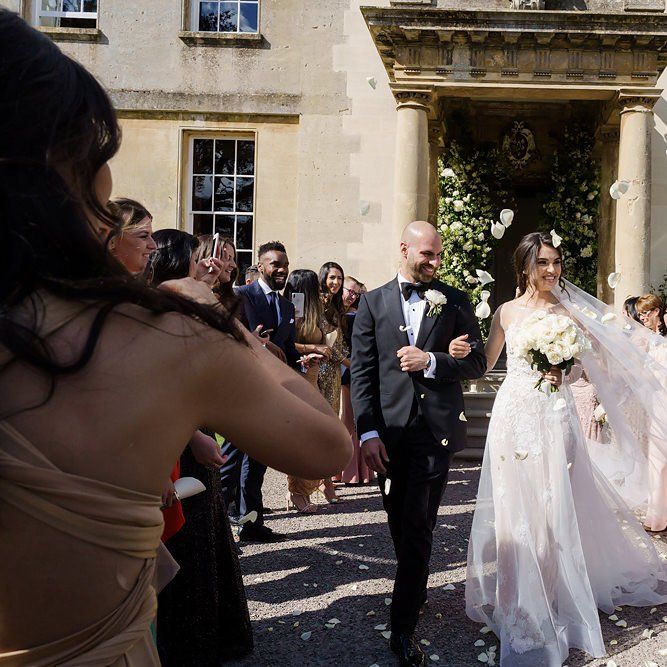 Confetti Exit with Bride in Berta Wedding Dress and Groom in Tuxedo