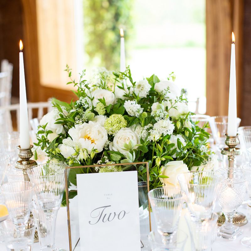White and Green Floral Centrepiece with Gold Table Number  Frame
