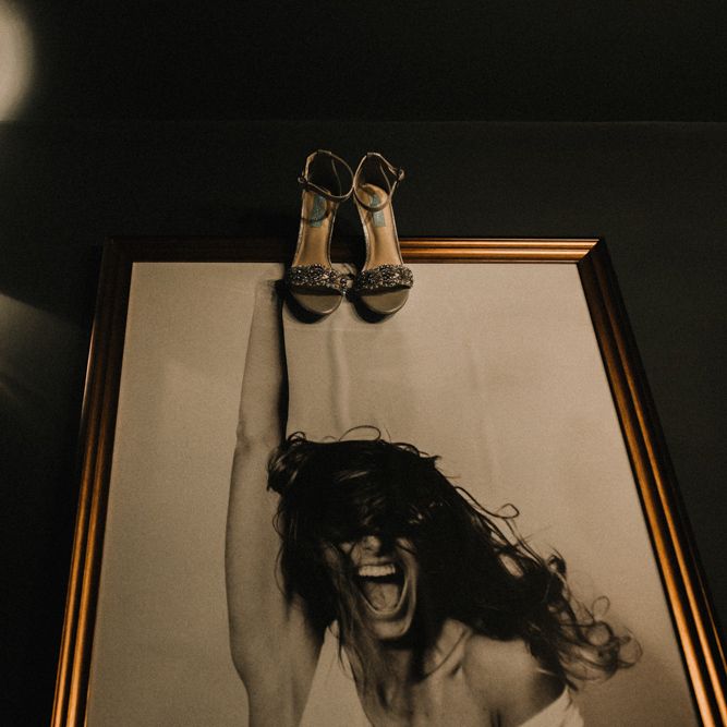 Jewelled Wedding Shoes Hanging Up on Wedding Morning
