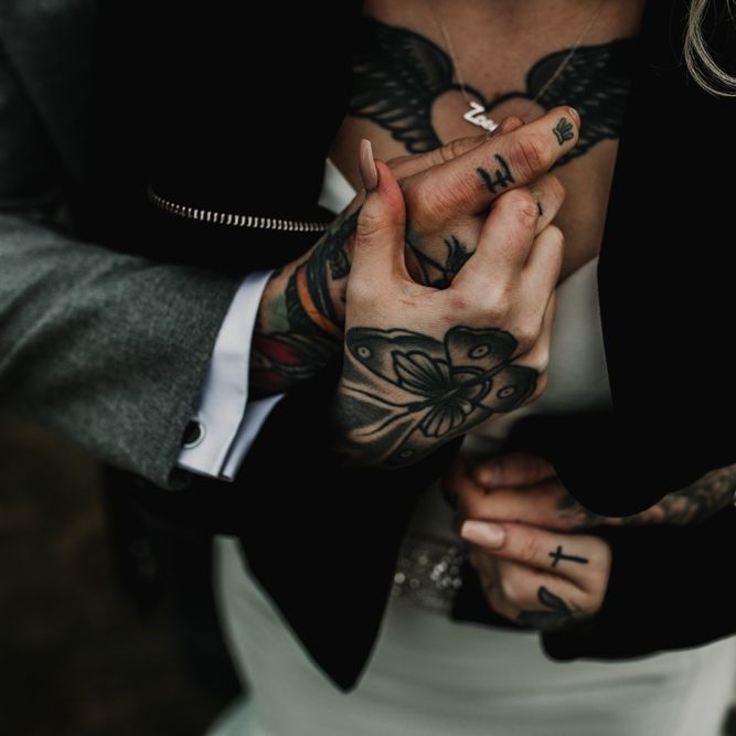 Tattooed Bride and Groom Embracing