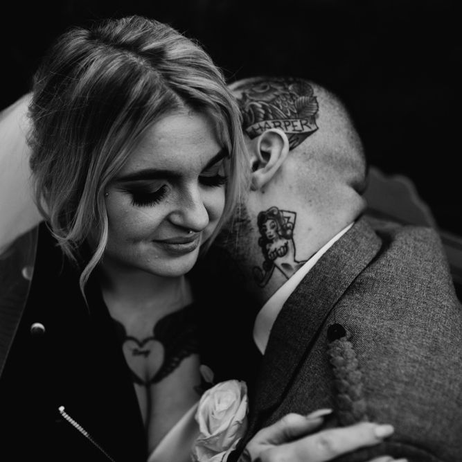 Tattooed Groom Kissing His Brides Neck in Leather Jacket