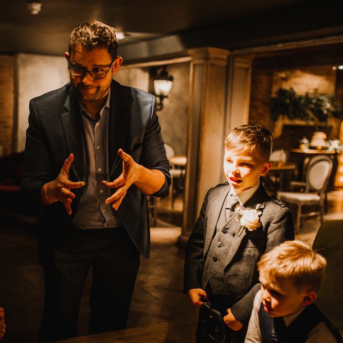 Magician Wedding Entertainer Performing a Trick