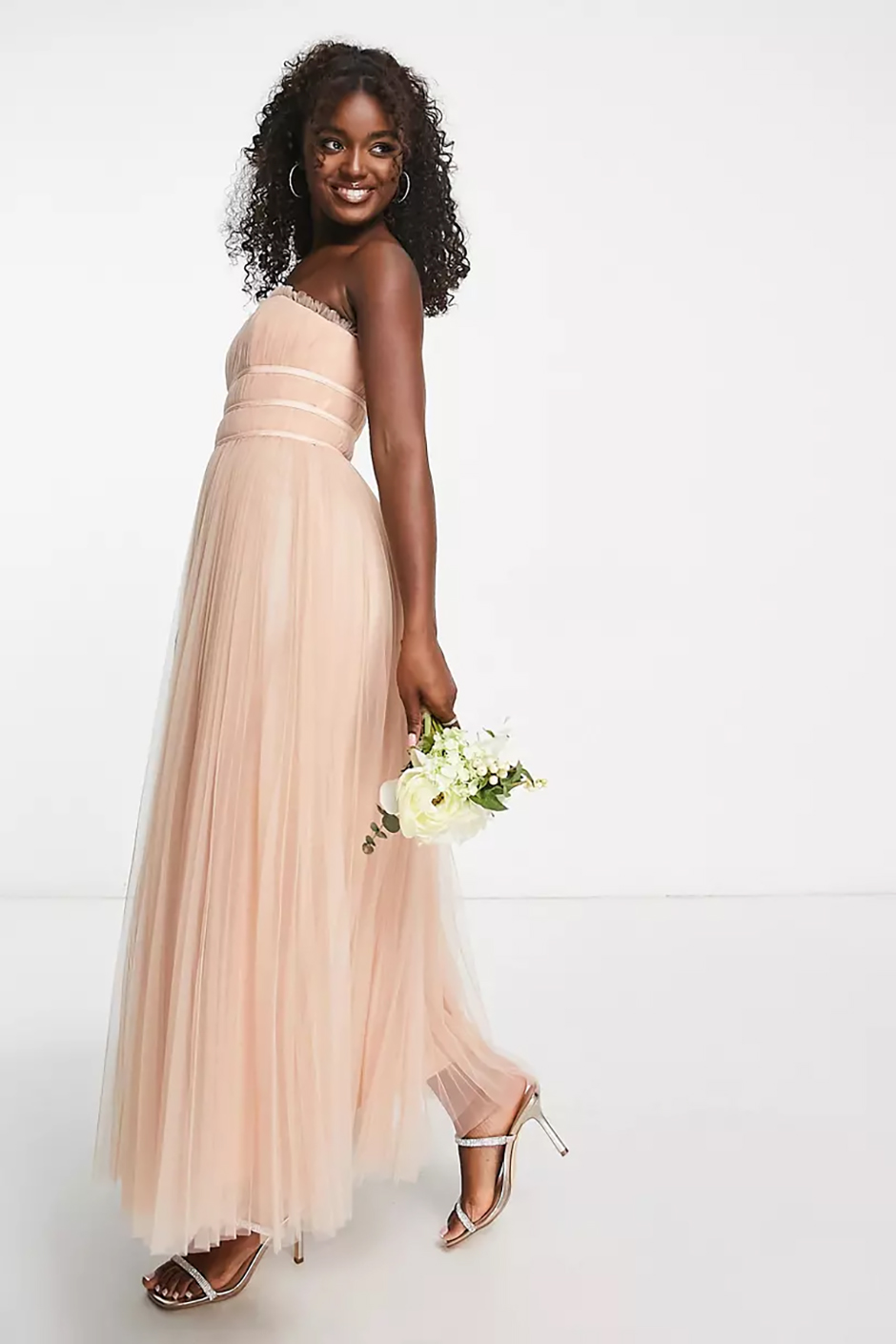 Blush peach bridesmaid dress from ASOS with strapless design and tulle maxi skirt