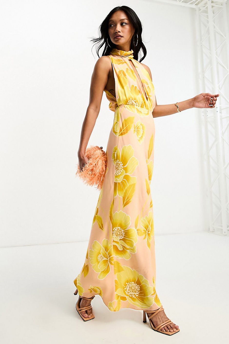 Beach wedding guest dress from Asos with halter neckline and yellow floral print
