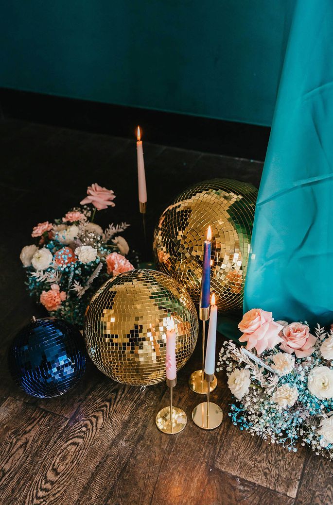 teal wedding inspiration with pastel pink flowers, gold candle sticks and glitter balls wedding decor 
