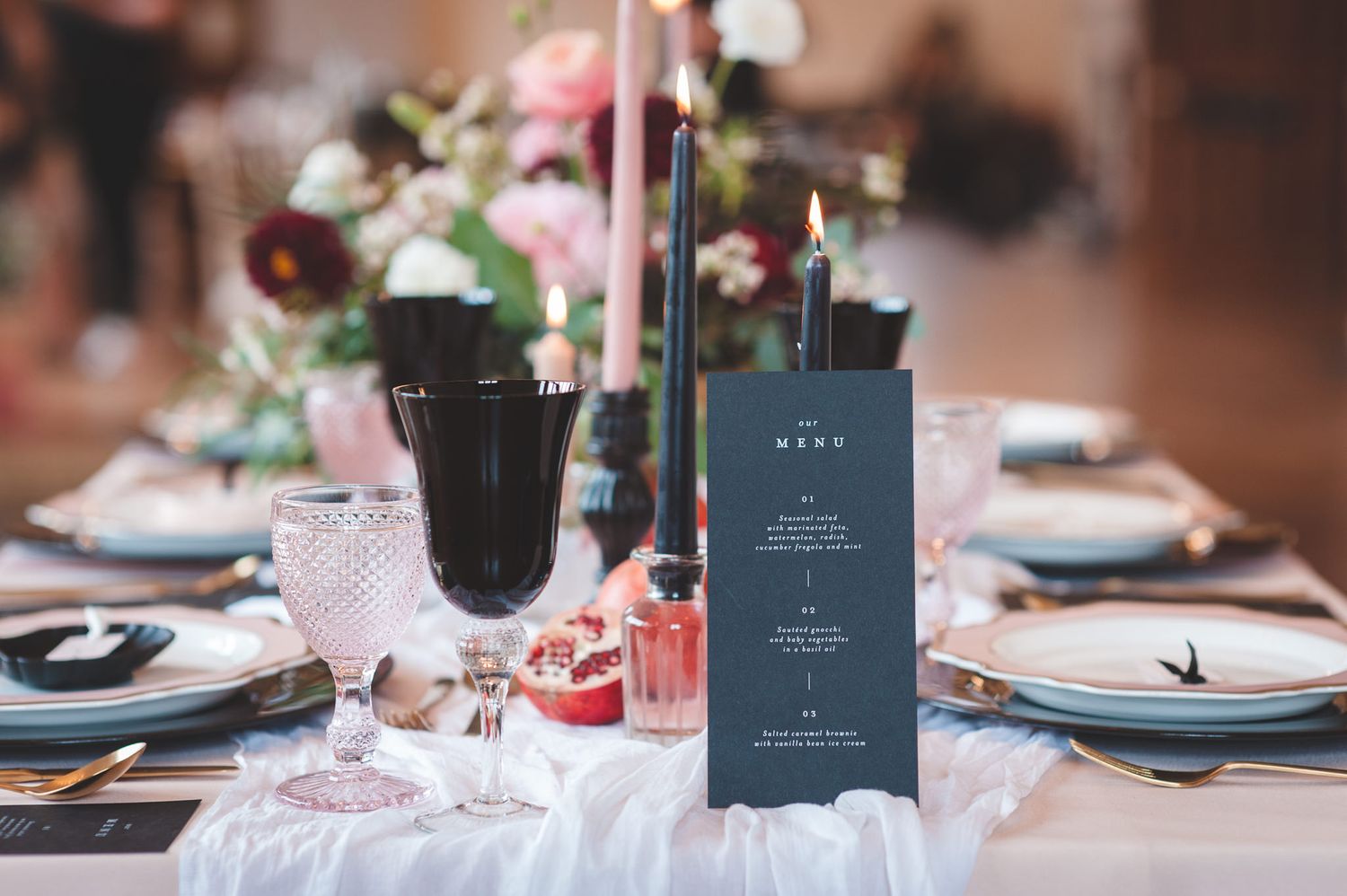 Black on the day wedding stationery menu card, taper candles and goblet table decor
