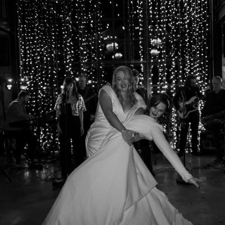 Deep V Wedding Dress for Two Brides at Hidden River Cabins Wedding