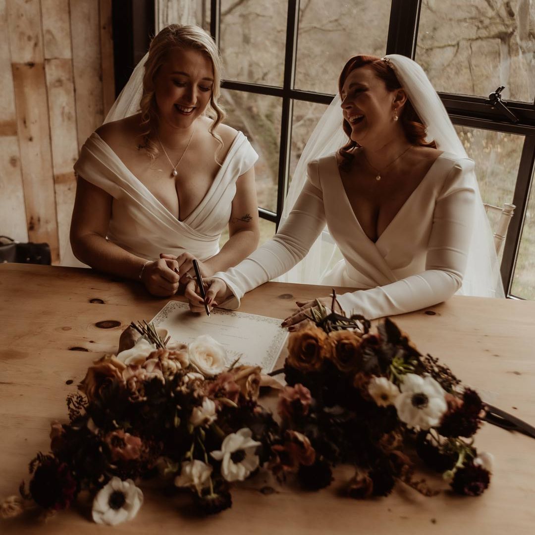 Deep V Wedding Dress for Two Brides at Hidden River Cabins Wedding