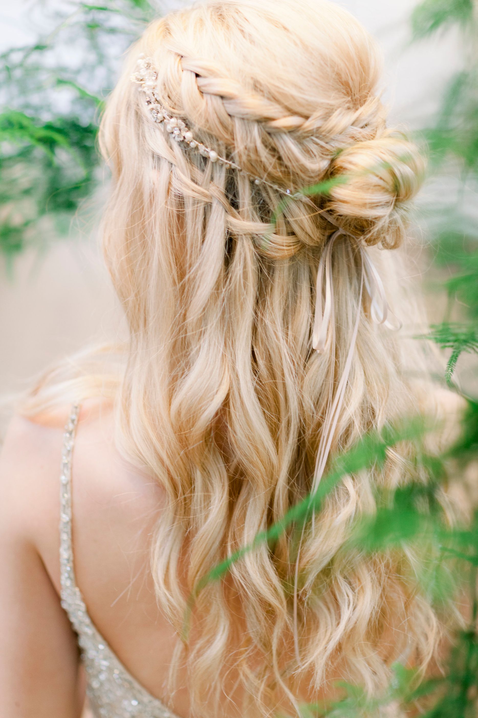 wildflower hair company blonde boho braided half up half down hairstyle with delicate hair vine