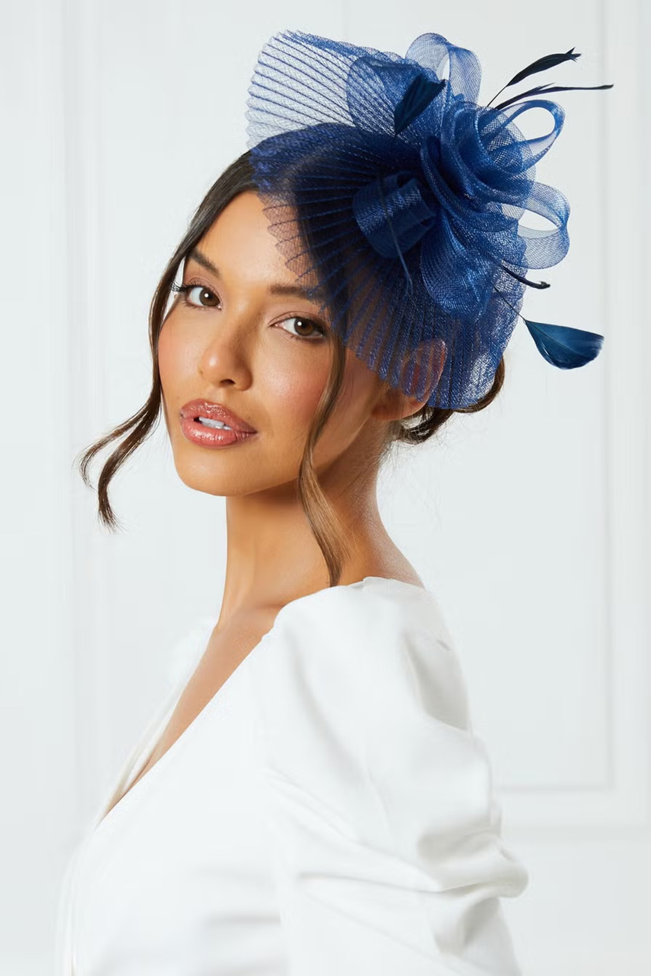 hair fascinators for wedding guests in navy from Quiz with flower design 