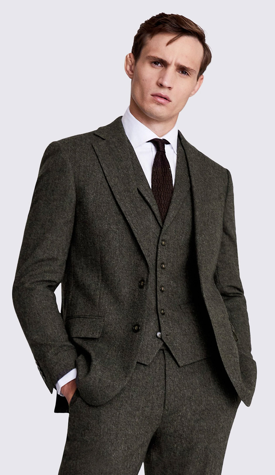 Tweed groom suit in earthy pine tone from Moss Bros