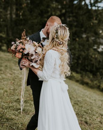 Dolomites Wedding on a mountain top with autumnal wedding bouquet and flower crown