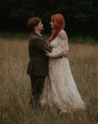 Lila's Wood outdoor wedding with the bride in boho lace wedding dress and groom. 