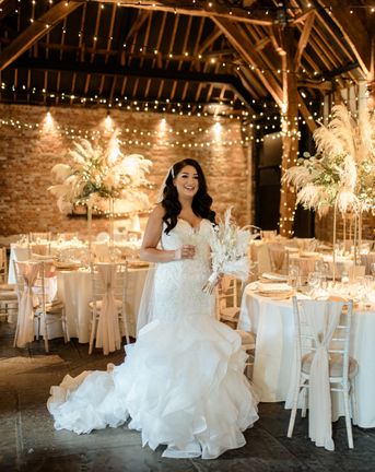 Intimate Cooling Castle Barn wedding with neutral colour scheme, dried flowers and fishtail wedding dress.