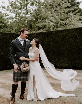 Pimhill Barn wedding with the groom in a kilt and bride in sparkly wedding dress.