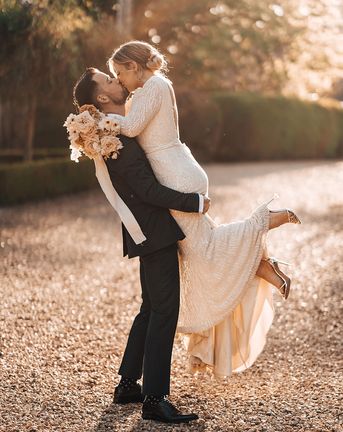 Bride and groom share a passionate and romantic kiss

