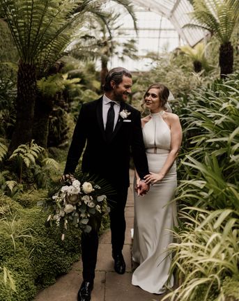 Elegant Tatton Park wedding with tropical flowers and halter neck dress