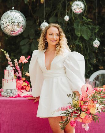 Polstrong Manor wedding with pink decor and bride in short puff sleeve wedding dress.