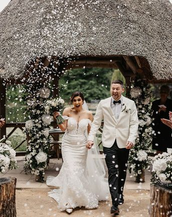 Bride and groom have confetti exit at The Orangery Kent.