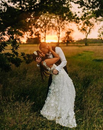 Reymerston Hall wedding with golden hour photos of bride and groom
