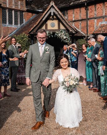 bride and groom have confetti exit at Langshott Manor in Surrey
