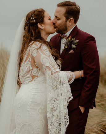 Boho Newton Hall wedding with the bride in a lace wedding dress.