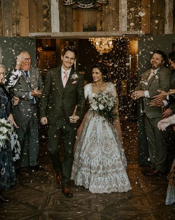Wharfedale Grange wedding for multicultural couple as they exit to confetti