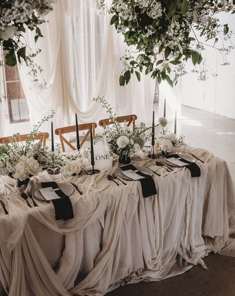 Black and white table setting for wedding at Willow Grange Farm.