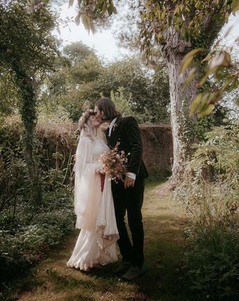 outdoor pagan wedding with vintage wedding dress and dried wedding flowers