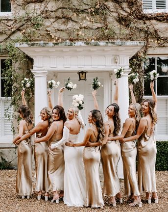 Black tie wedding at Northbrook Park with champagne gold bridesmaid dresses 