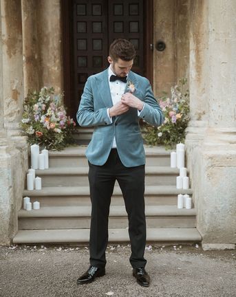 Groom in a blue velvet blazer for country house wedding