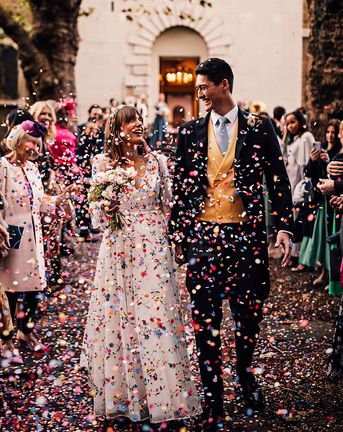 Crypt On The Green wedding with bright confetti exit