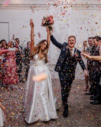 Stylish London wedding at The Loft Studios planned in 4 months with a gospel flash mob choir, 1KG of confetti and pink bridesmaid dresses.