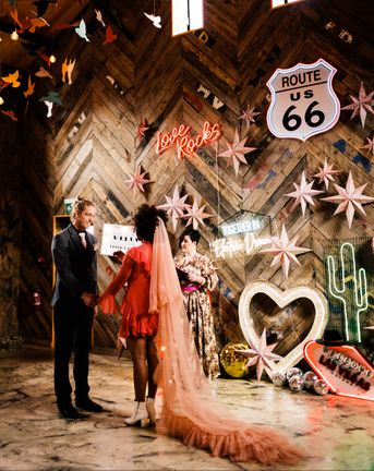 Fun Neon wedding inspiration at The Canary Shed in Essex with Red wedding dress, and colourful flowers 