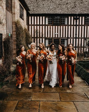 autumn bridesmaid dresses for bridal party in matching orange gowns