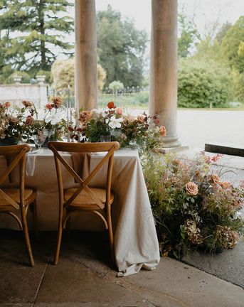 Prestwold Hall botanical wedding inspiration with outdoor tablescape, floral table runner & a lace wedding dress by Safrina Smith Photography