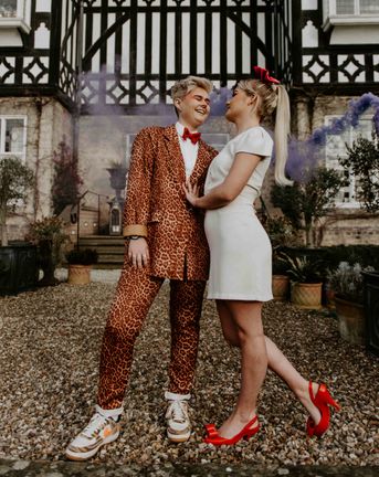 Pink and orange fun, retro LGBTQ+ wedding inspiration with roller skates, disco balls and a tulip bouquet by Lucy Dennis Photography