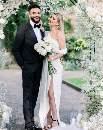 Sophisticated summer Garthmyl Hall wedding with white flowers and black-tie fashion