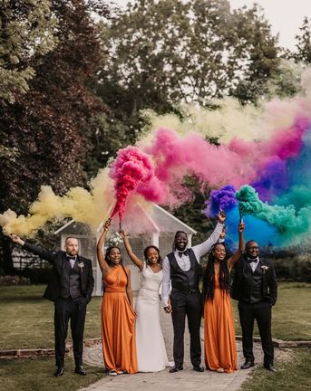 Hayne House wedding with black couple, orange bridesmaid dresses and colourful smoke bomb portraits 