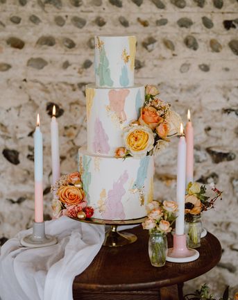Pastel painted iced wedding cake.