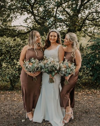 bride and bridesmaids in brown bridesmaid dresses at Chycara wedding