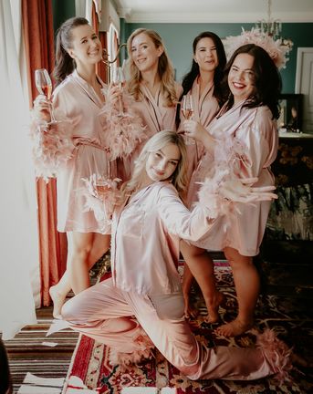 Galentine's theme ideas with groups of friends in pink feather pyjamas 