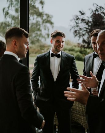 groom in black tuxedo ben barron photography