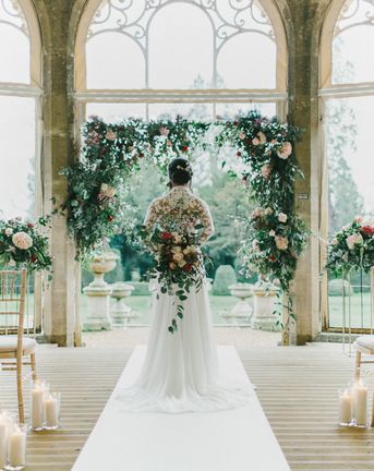 Blush & Burgundy Floral Fairytale Wedding at Grittleton House Planned & Styled by Jennifer Louise Weddings with Floral Arch. Katherine Yiannaki Photography