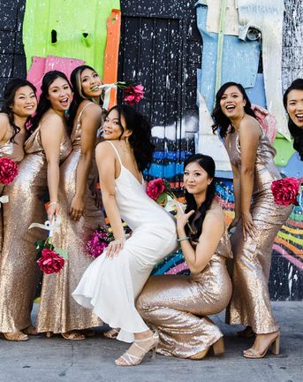 Las Vegas Wedding with Gold Sequin Bridesmaids Dresses and Silk Flowers | BHLDN Wedding Dress | Neon Museum | Chris Barber Photography